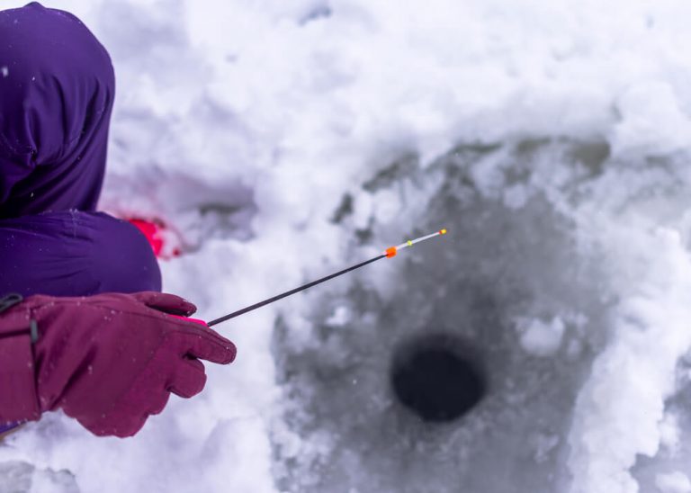 Girl Ice Fishing Wearing Gloves